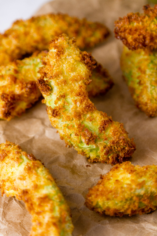 Air Fryer Avocado Fries on a brown paper 