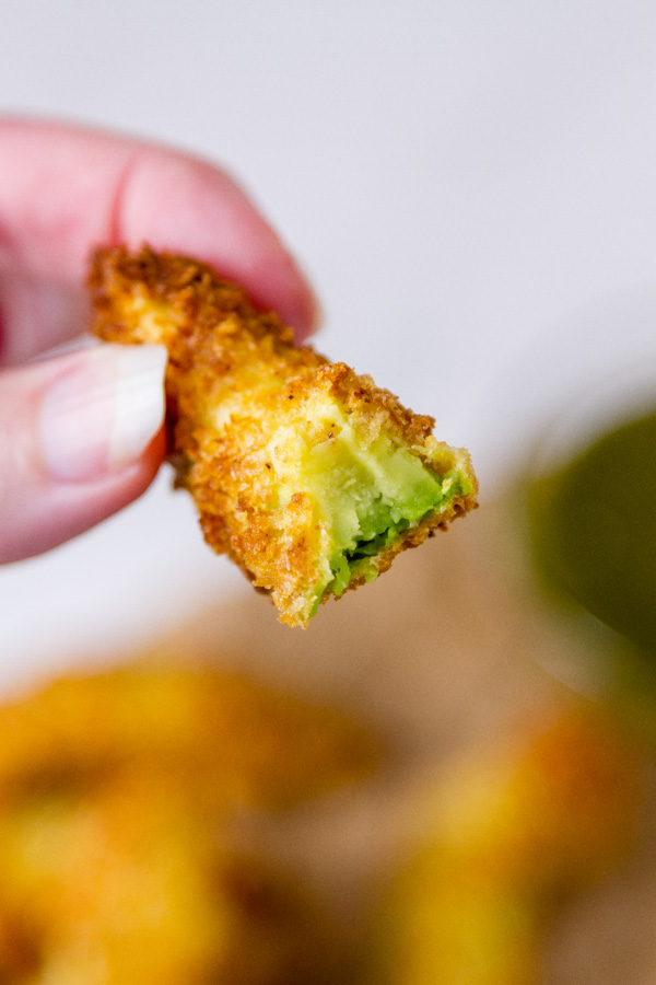 bite taken of the Air Fryer Avocado Fries so you can see the inside