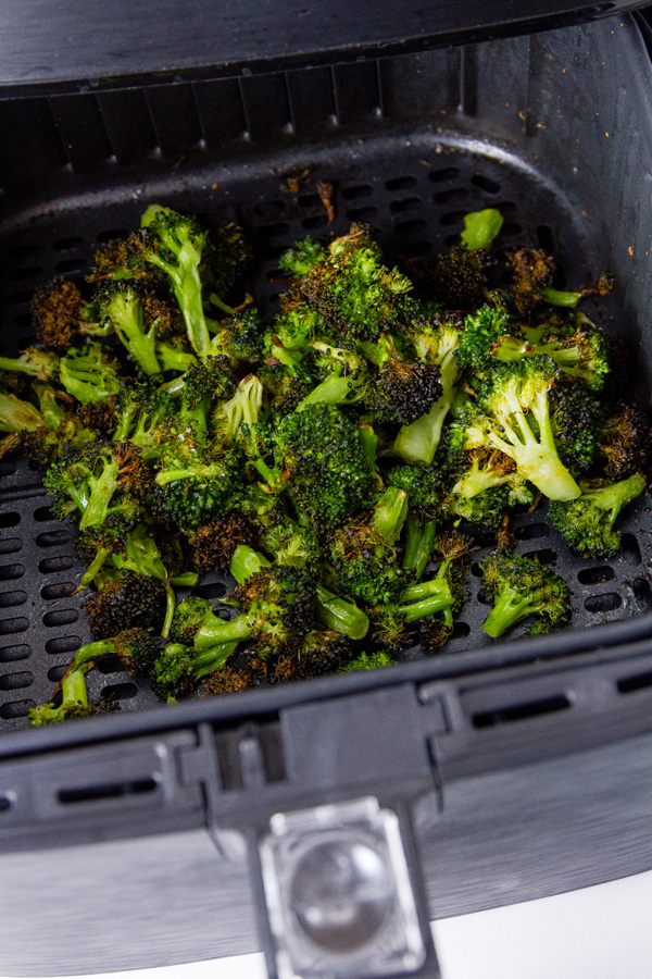 Air Fryer Roasted Broccoli in the basket of the air fryer after cooking