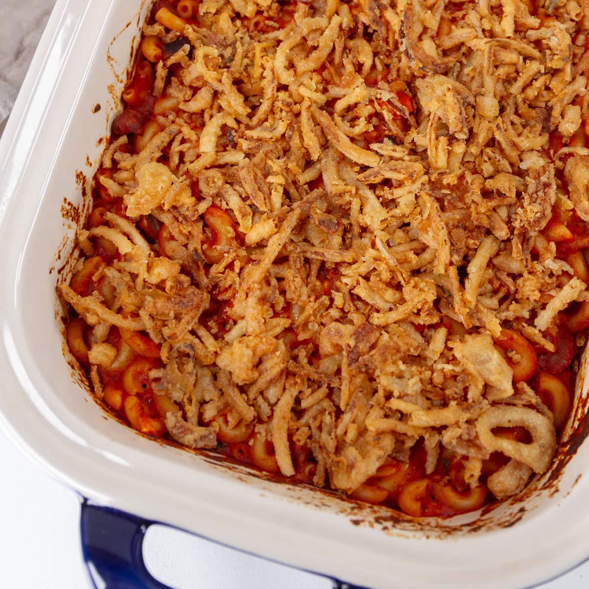 square crop of the baked casserole dish of chili mac.