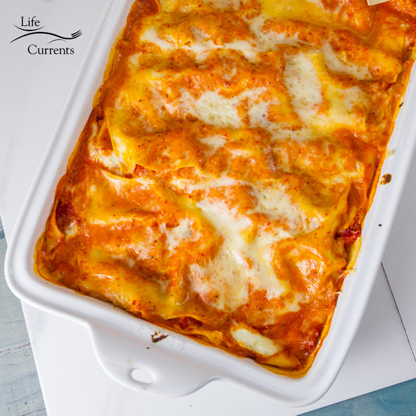 Sqare crop of Red Pepper Lasagna in a white pan