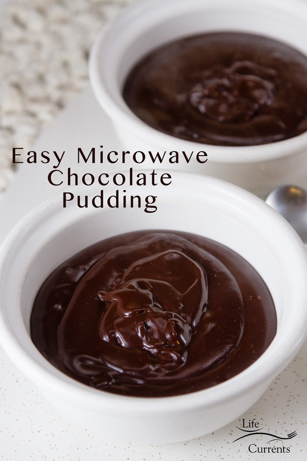 Two bowls of Chocolate Pudding, white bowls on a white knitted placemat and the title in the image 