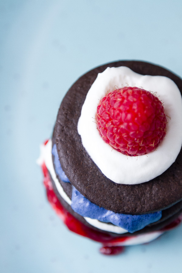 top down view on one of the Patriotic Icebox Cakes - stacked cookies and whipped cream with jam and rasberries 