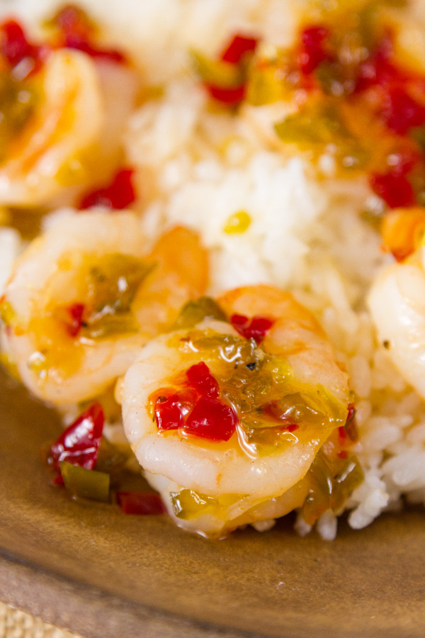 close up of shrimp in sauce on rice 