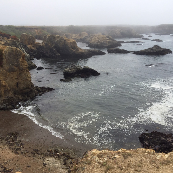 Looking down the cliffs into the coves at Glass Beach