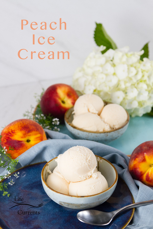 two bowls of peach ice cream on blue plates with peaches around and some flower. Title on image: Peach Ice Cream
