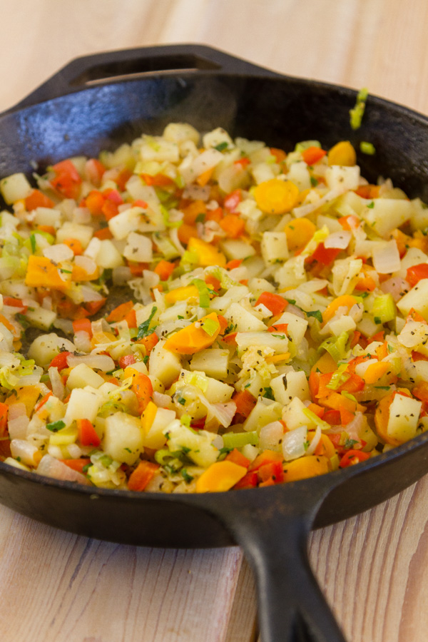 the filling for the turnovers after being cooked in a cast iron skillet 