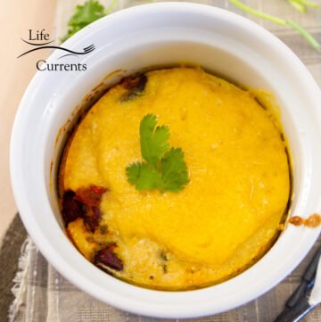 square crop looking down onto the cornbread topping on the tamale pie in the ramekin