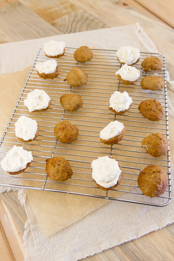 cookies laid out, some with frosting, some without