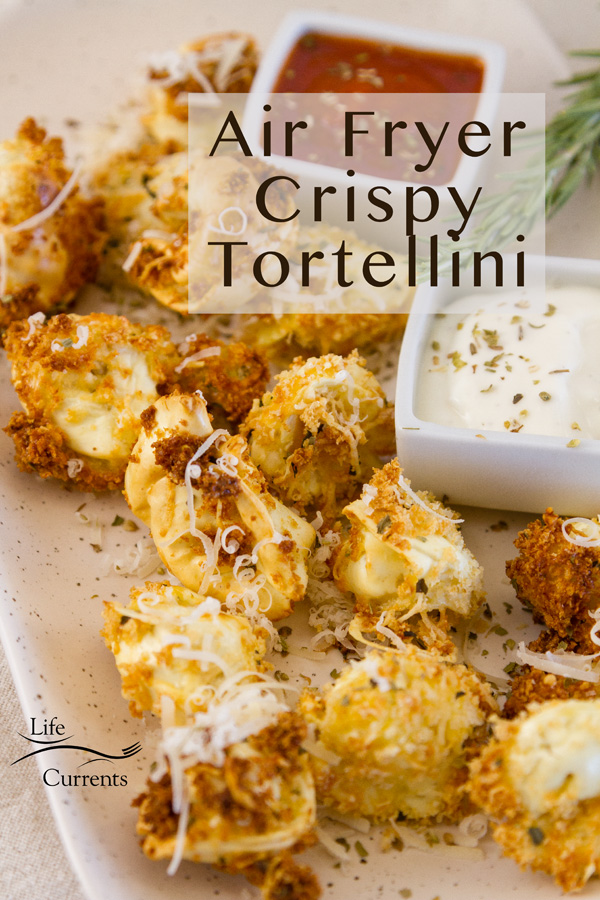 Air Fryer Crispy Tortellini with title sprinkled with Parmesan and served with marinara and Alfredo