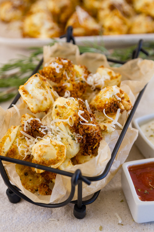 Crispy Tortellini served in an appetizer basket with dipping sauces