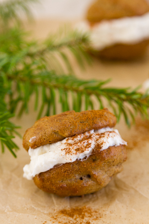 Spice Cakes with creme filling and a dash of cinnamon with evergreen boughs