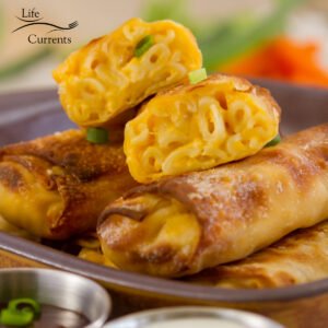 square crop of Mac and Cheese Egg Rolls on a serving plate garnished with green onions
