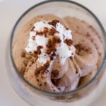 close up on Chocolate Mousse with whipped cream and cocoa powder