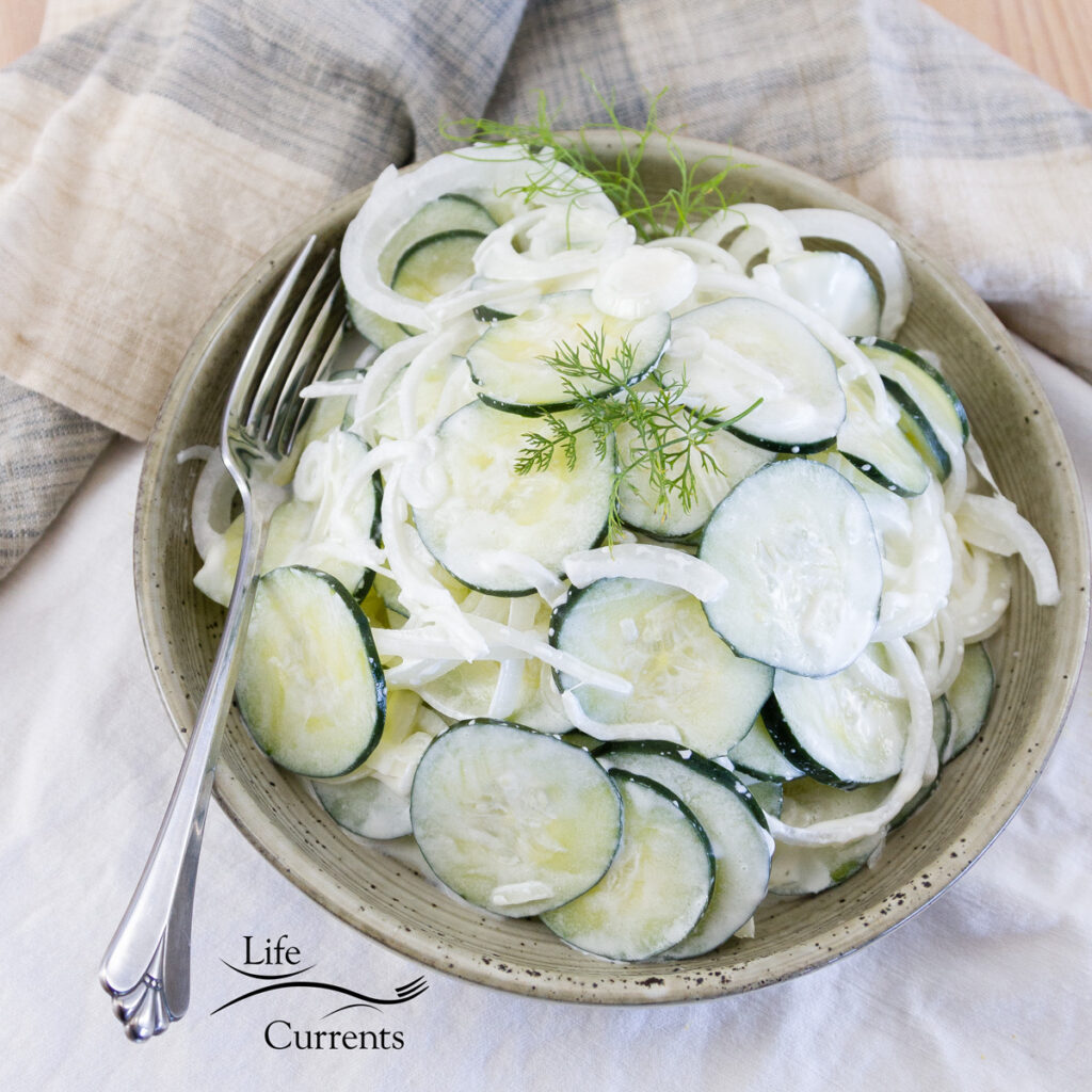 square crop of salad in a bowl with a fork