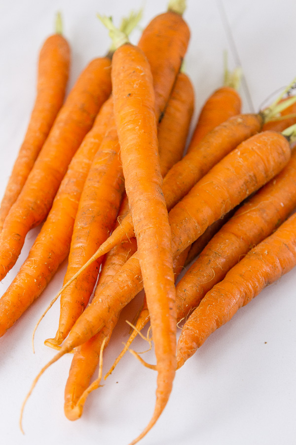 long skinny carrots with their tops taken off