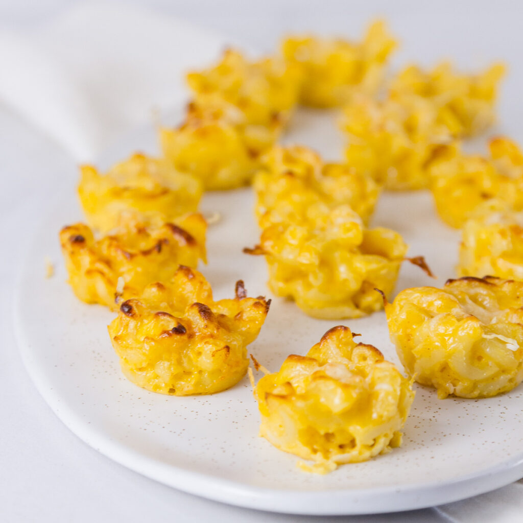mac & cheese appetizers on a platter ready to be served