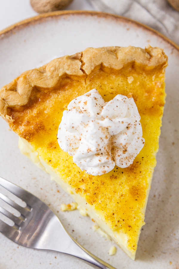 top down on a slice of pie with whipped cream