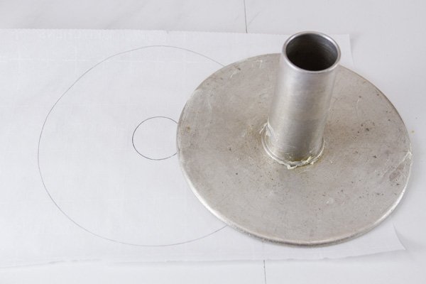 drawing the circles to cut out the parchment paper to line the pan to bake the cake