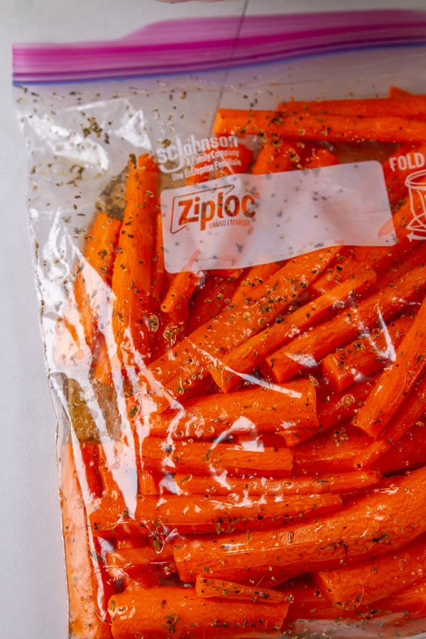 cut carrots with spices in a zip top bag.