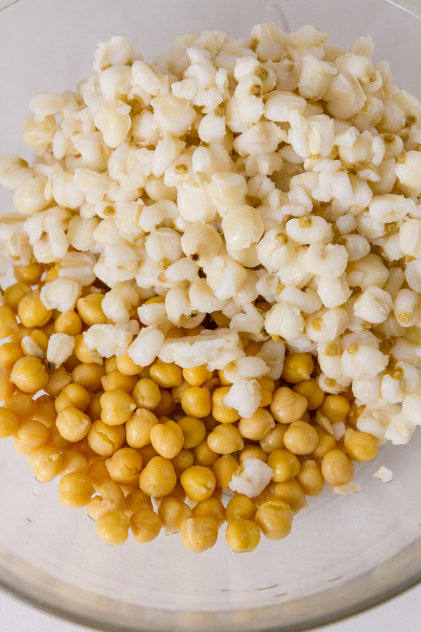 hominy and garbanzo beans in a glass bowl