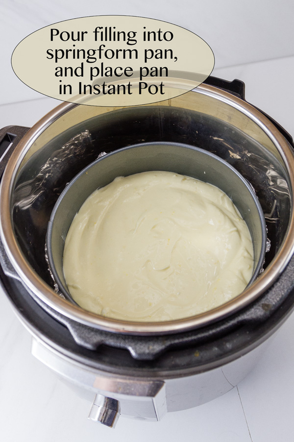 looking into the instant pot with the cheesecake inside