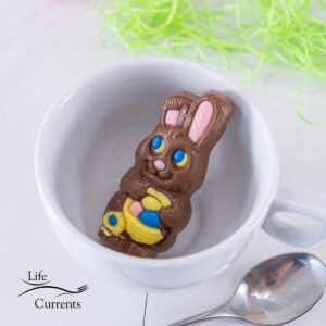 a chocolate Easter bunny in a white mug