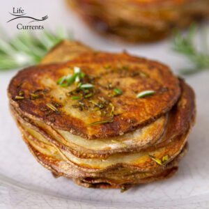 square crop of a close up on roasted stacked potatoes