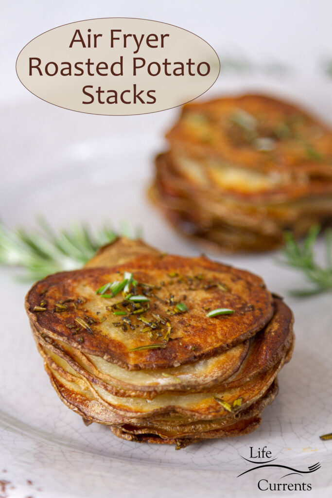 two stackes of sliced roasted potatoes with fresh rosemary, title on top of image: