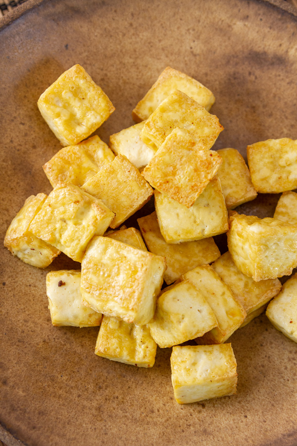 cooked tofu on a plate.