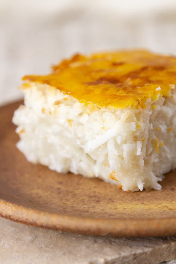 close up of a slice of coconut cake to show the texture and the crust.