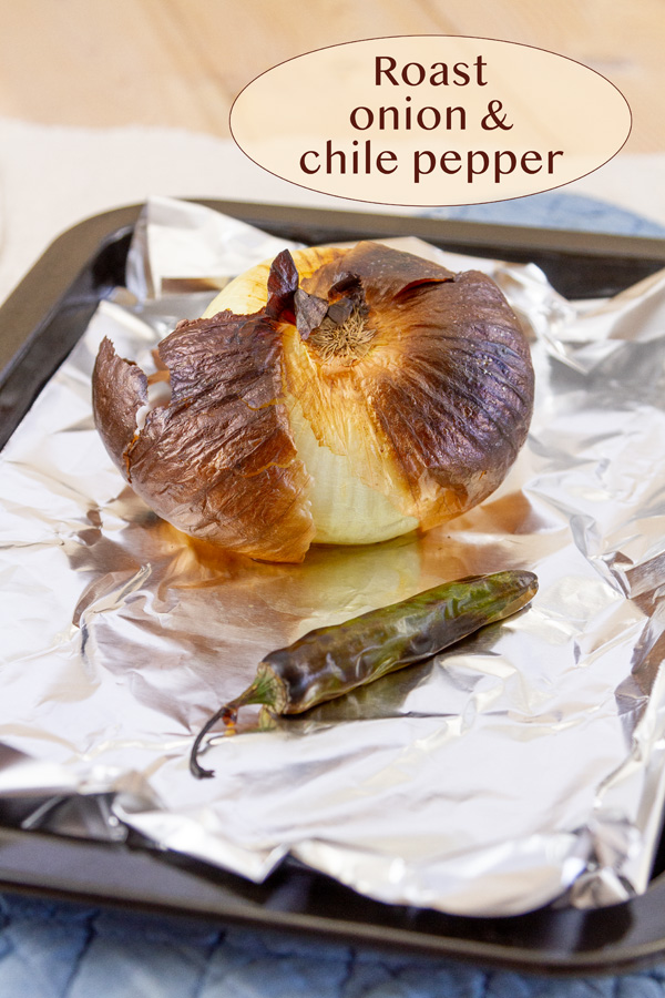 broiled onion and chile pepper on a foil lined pan.