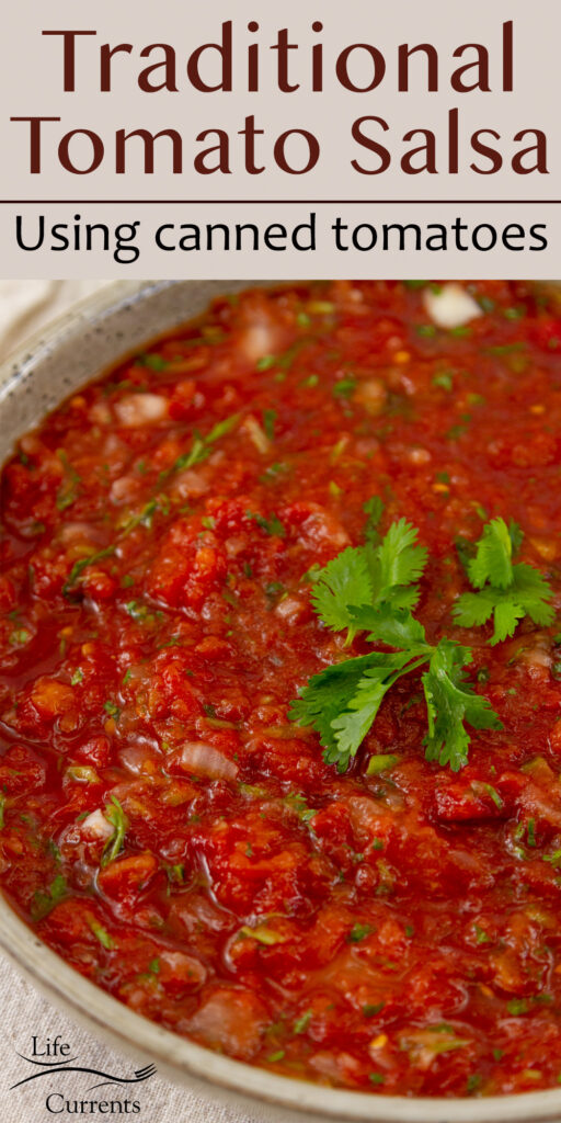 a large bowl of tomato salsa garnished with cilantro leaves, title on top: Traditional Salsa Recipe using canned tomatoes.
