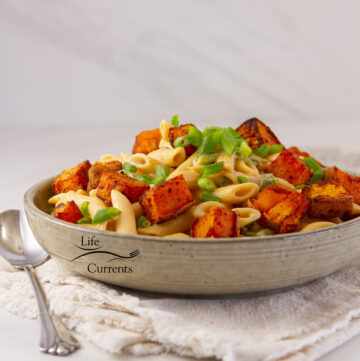 square crop of pasta served with roasted sweet potatoes.