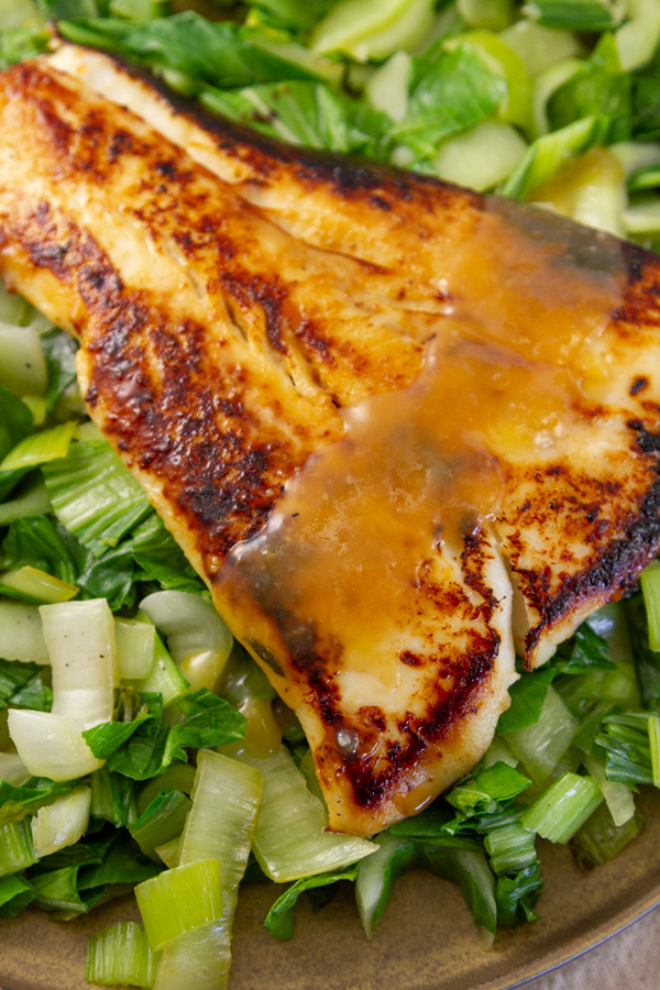 cooked black cod with miso sauce on bok choy.