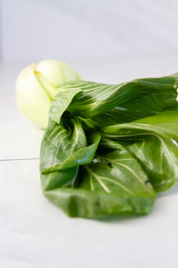 looking into the leaves of a head of baby bok choy.