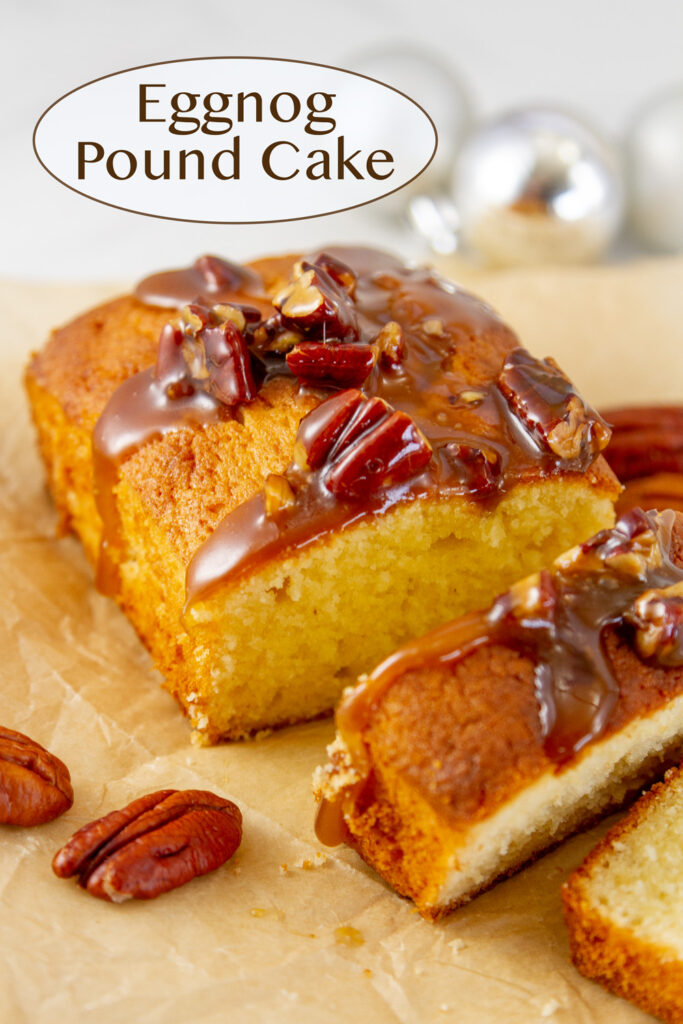 Eggnog Pound Cake sliced open so you can see inside, title on upper left, pecans and Christmas ornaments surround it.