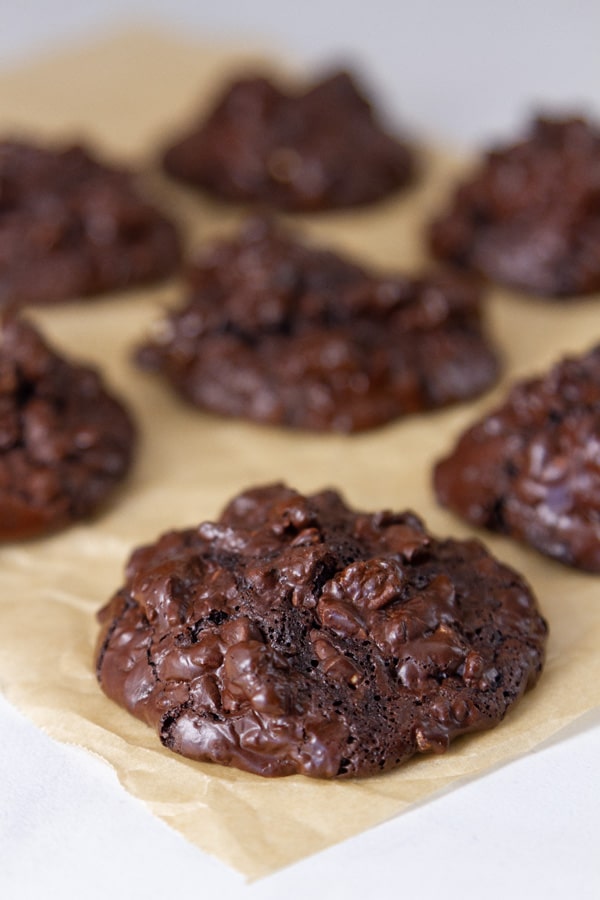 chocolate cookies on a piece of parchment paper.