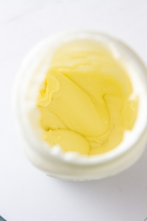 looking down into a mason jar filled with fresh whipped cream.