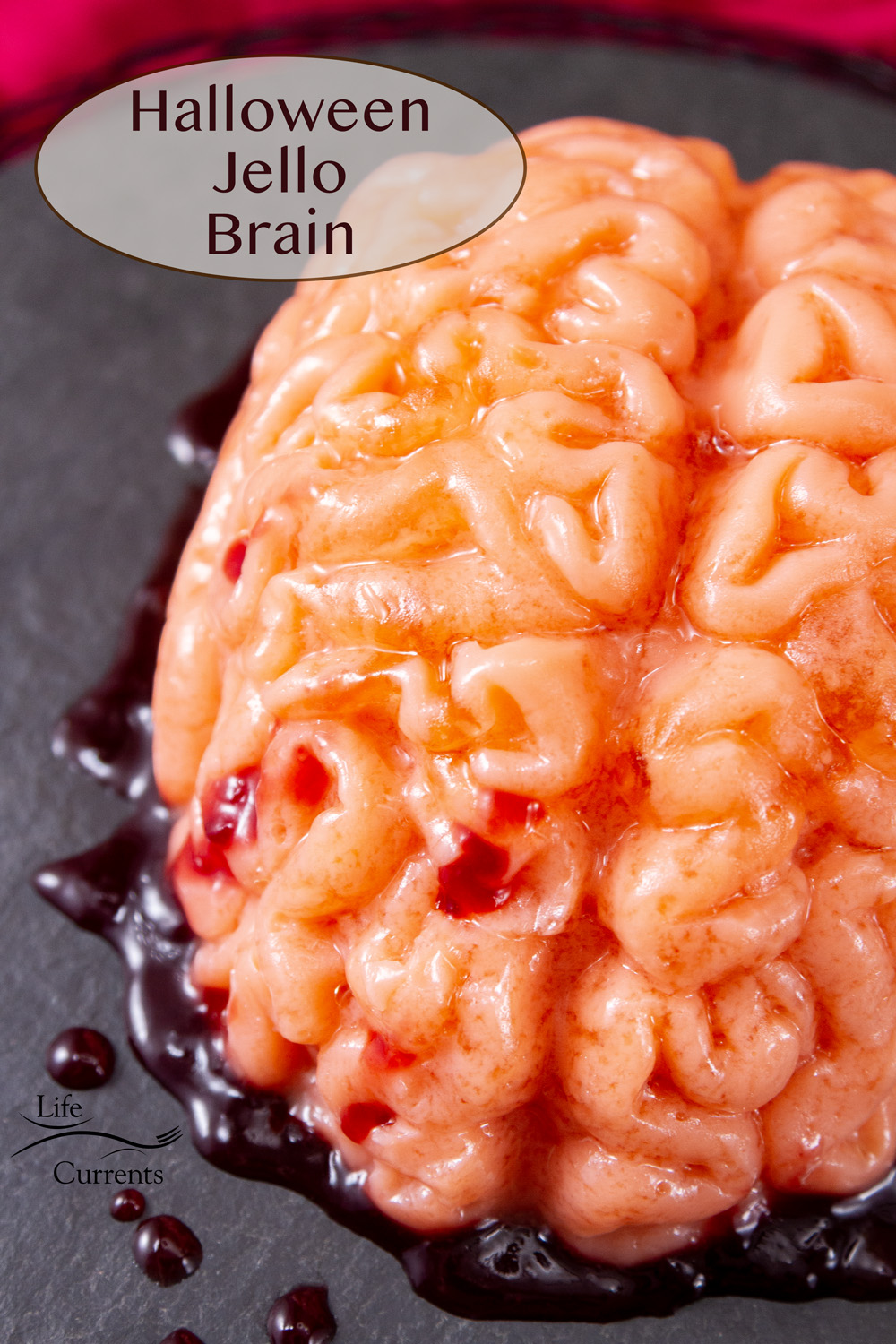 a pink fleshy Halloween brain with raspberry jam "blood" around it, title on upper left.