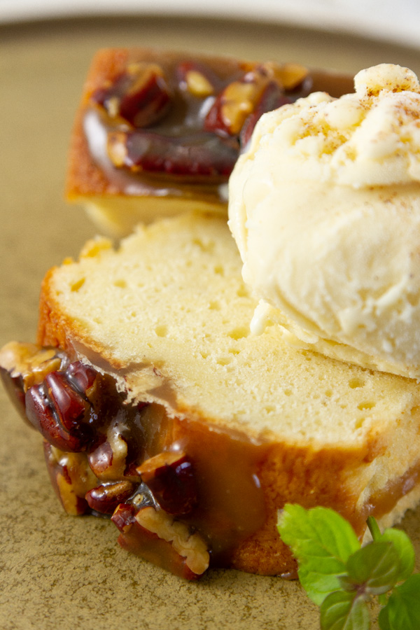 two slices of cake served with eggnog ice cream with a sprig of mint