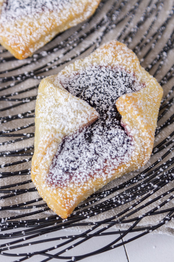 a folded cookie that has opened up to show the filling.