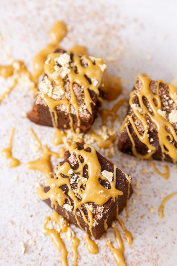 looking down on pieces of mochi cakes garnished with peanut butter.