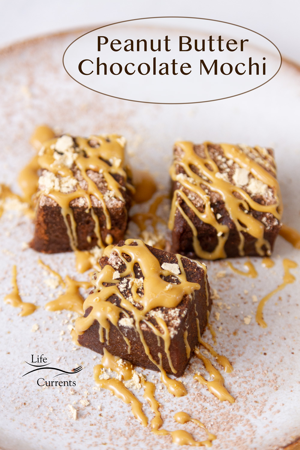 Three squares of chocolate mochi on a plate garnished with peanut butter, title on image: Peanut Butter Chocolate Mochi.