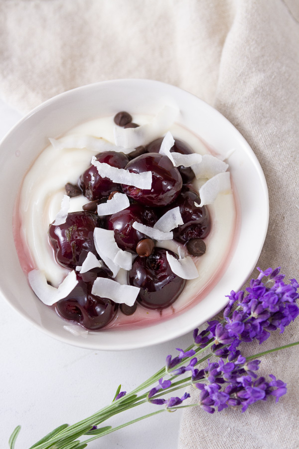 stewed cherries with chocolate chips and coconut over yogurt.