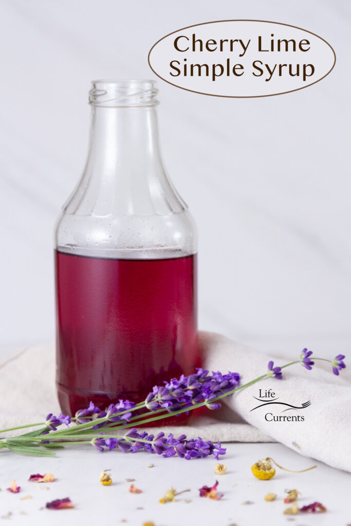 a bottle of pink Cherry Lime Simple Syrup with flowers in front of it, title on top.