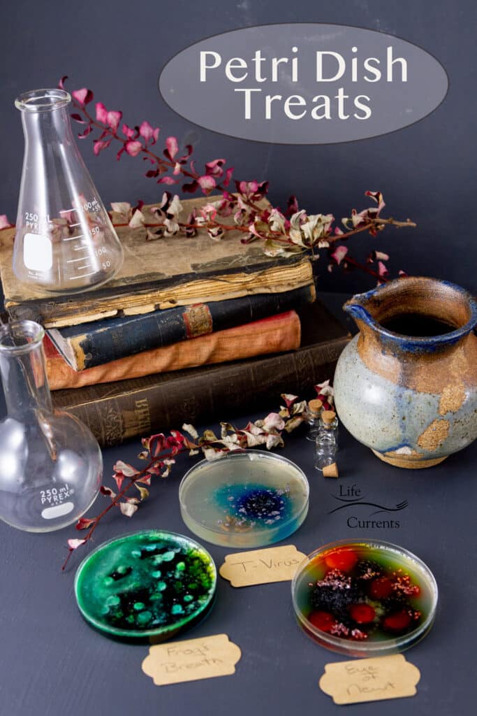 Petri Dish Treats with funny labels next to a stack of books, measuring containers, and some leaves.