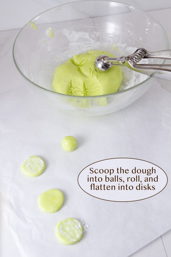 dough in a glass mixing bowl, rolled into balls, and flattened into disks.