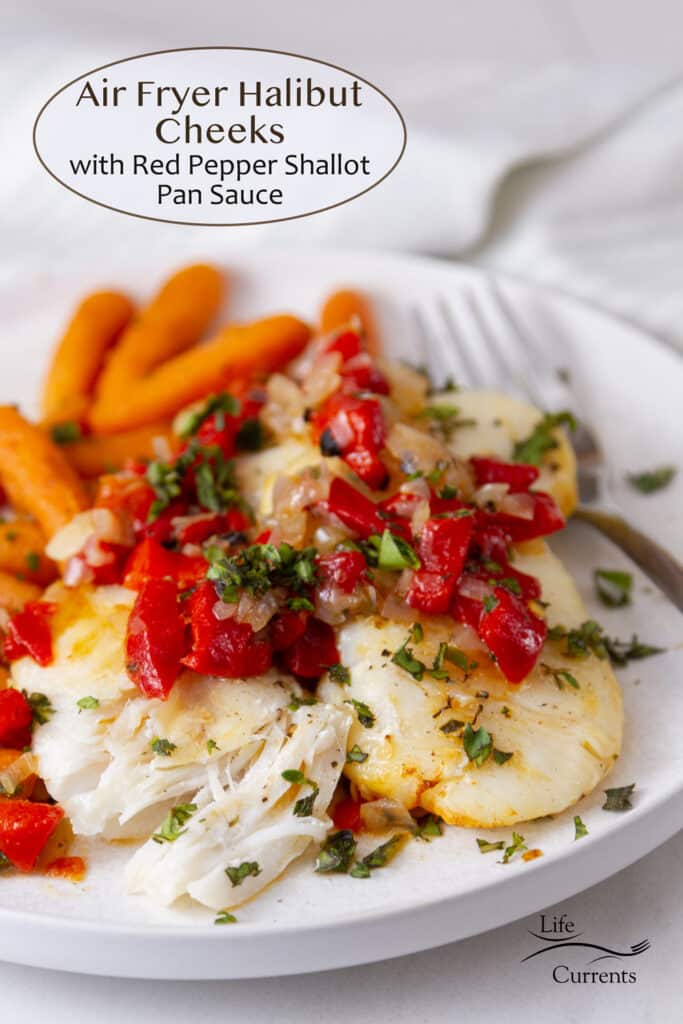 Cooked halibut cheeks on a white plate with red pepper sauce served with cooked carrots.