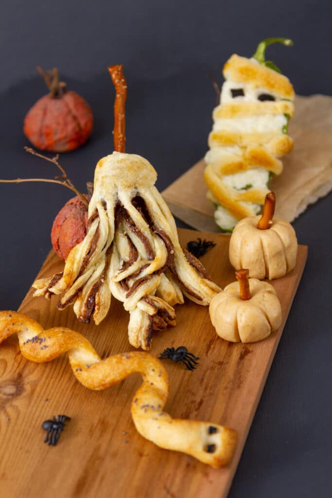 4 fun edible Halloween treats recipes including brooms, mummies, pumpkins, and snakes.